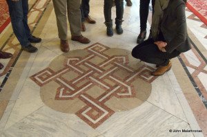 The tiles of every floor are decorated with the pattern of the building.